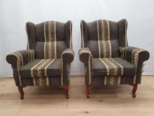 A pair of vintage Queen Anne footed Wingback upholstered arm chairs
