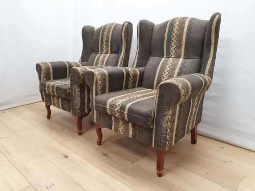 A pair of vintage Queen Anne footed Wingback upholstered arm chairs