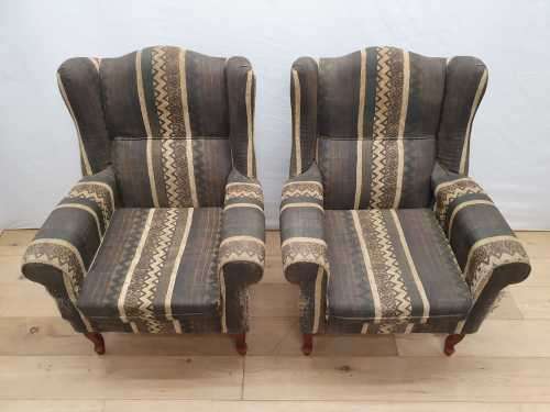 A pair of vintage Queen Anne footed Wingback upholstered arm chairs