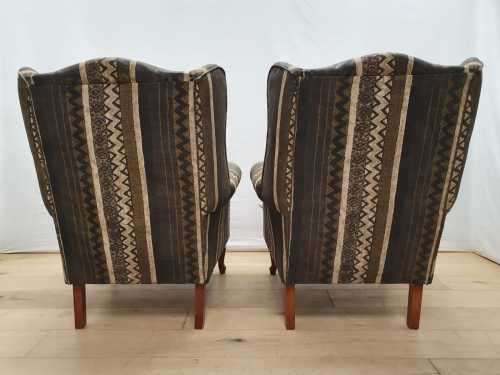 A pair of vintage Queen Anne footed Wingback upholstered arm chairs