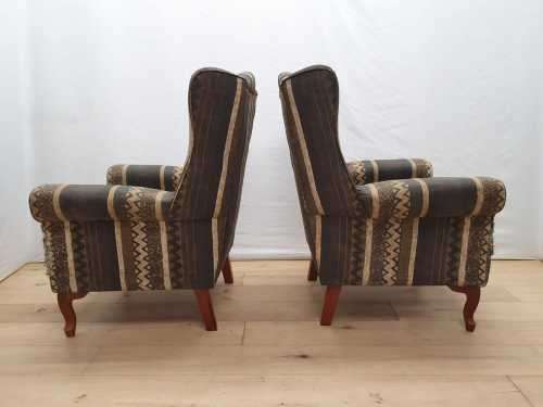 A pair of vintage Queen Anne footed Wingback upholstered arm chairs