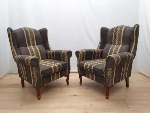A pair of vintage Queen Anne footed Wingback upholstered arm chairs