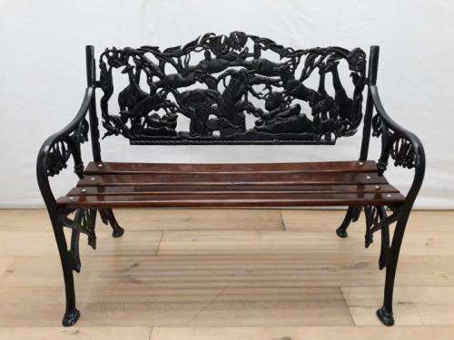 A cast iron slatted wood all weather garden/ patio bench.