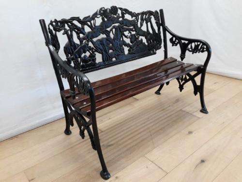 A cast iron slatted wood all weather garden/ patio bench.