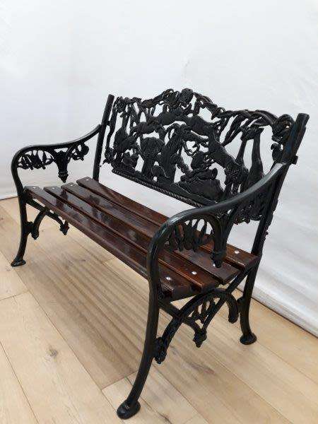 A cast iron slatted wood all weather garden/ patio bench.