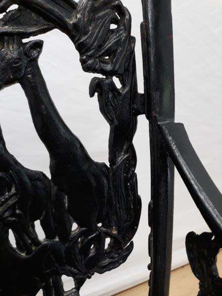 A cast iron slatted wood all weather garden/ patio bench.