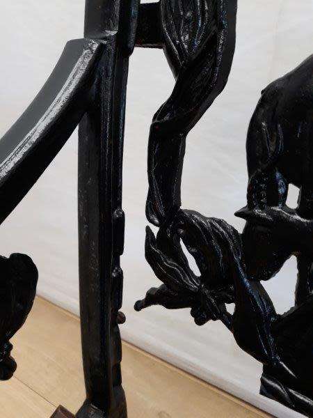 A cast iron slatted wood all weather garden/ patio bench.