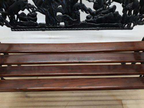 A cast iron slatted wood all weather garden/ patio bench.