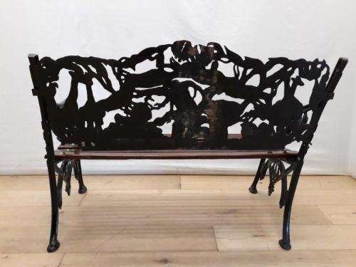 A cast iron slatted wood all weather garden/ patio bench.