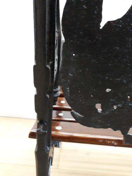 A cast iron slatted wood all weather garden/ patio bench.