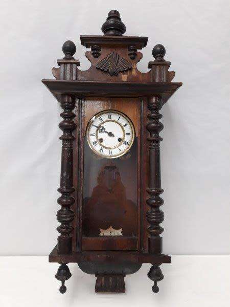 A gorgeous vintage wall hanging clock case with a glass door for restoration