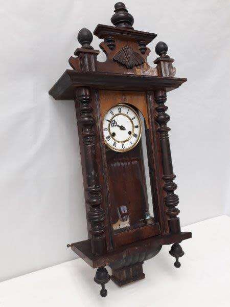 A gorgeous vintage wall hanging clock case with a glass door for restoration
