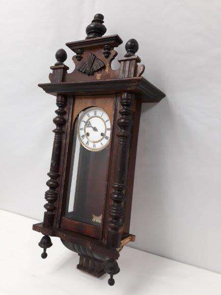 A gorgeous vintage wall hanging clock case with a glass door for restoration