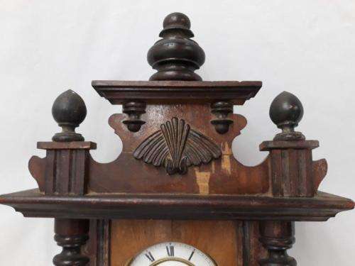 A gorgeous vintage wall hanging clock case with a glass door for restoration