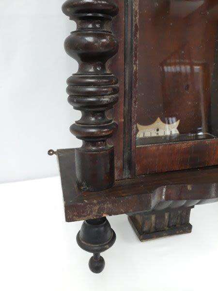 A gorgeous vintage wall hanging clock case with a glass door for restoration