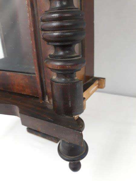 A gorgeous vintage wall hanging clock case with a glass door for restoration