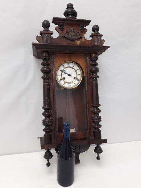 A gorgeous vintage wall hanging clock case with a glass door for restoration