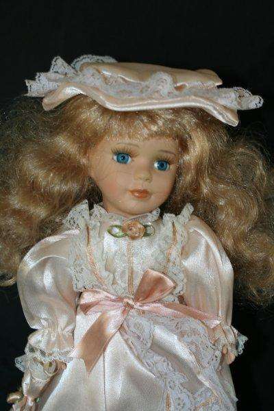 A BEAUTIFUL BLOND BLUE EYED PORCELAIN DOLL!!!