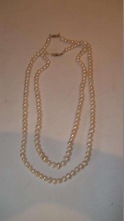 TWO STUNNING VINTAGE WILD PEARL NECKLACES. BOTH STRINGS ARE IMMACULATE