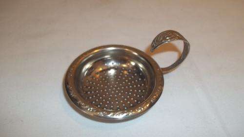 WONDERFUL OLD TEA STRAINER WITH ROUNDED HANDLE AND RIM TO REST ON THE CUP - VERY UNUSUAL PIECE