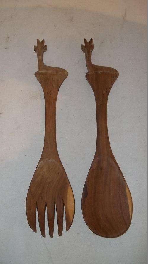 A STUNNING PAIR OF HAND-CARVED WOODEN SALAD SERVING SET WITH CARVED "DUIKER" ON THE HANDLES