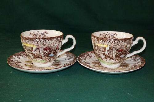 A PAIR OF VINTAGE JOHNSON BROTHERS IRONSTONE "COACHING SCENES" BROWN & WHITE CUPS AND SAUCERS