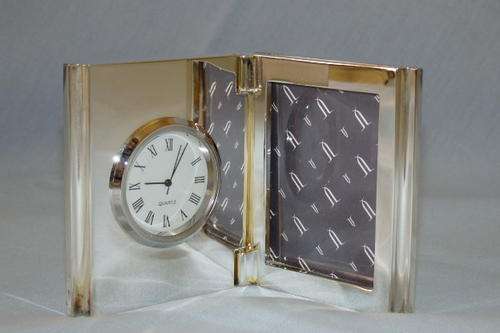 AN AWESOME BOXED SILVER PLATED "FOLDABLE" PICTURE FRAME WITH A BUILT IN QUARTZ CLOCK