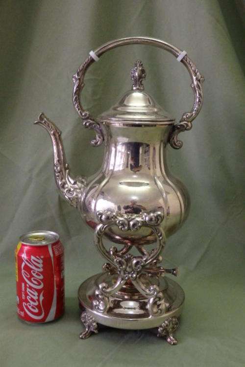 AN INCREDIBLE VINTAGE SILVER PLATED TILTING/ TIPPING TEAPOT WITH STUNNING ORNATE MOULDED DETAILING