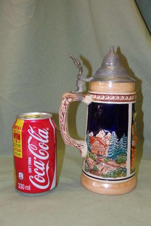 A FANTASTIC COLLECTIBLE TRADITIONAL THEMED GERMAN MADE LIDDED STONEWARE BEER STEIN