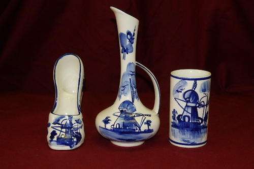 THREE EXQUISITE HAND PAINTED BLUE AND WHITE CERAMIC ORNAMENTS INCLUDING A VASE, SHOE AND PITCHER