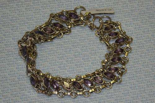 A SPECTACULAR AMETHYST BRACELET WITH 24 BEAUTIFUL STONES SET IN A STERLING SILVER SETTING
