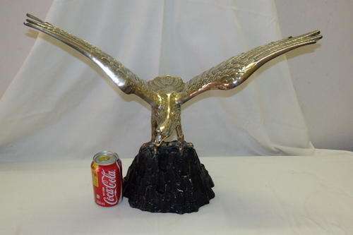 A SPECTACULAR (LARGE) BRASS "SOARING EAGLE" STATUE/ FIGURINE MOUNTED ON A BLACK METAL BASE