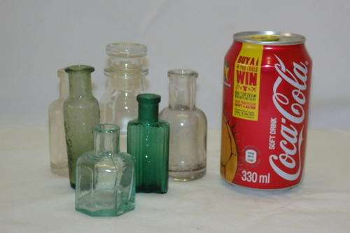 A FANTASTIC COLLECTION OF SIX ASSORTED VINTAGE MEDICINE BOTTLES INCL A 1866 GERMAN BOTTLE bid/bottle
