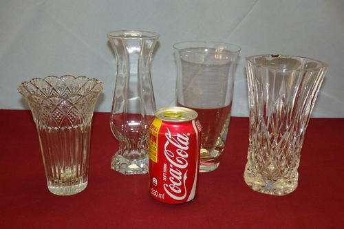 A BEAUTIFUL COLLECTION OF FOUR FLOWER VASES INCLUDING A CUT CRYSTAL VASE bid/vase