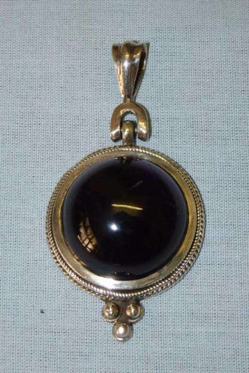 A MAGNIFICENT VERY LARGE ROUND OPAQUE AMETHYST STONE SET IS AN INCREDIBLE STERLING SILVER PENDANT