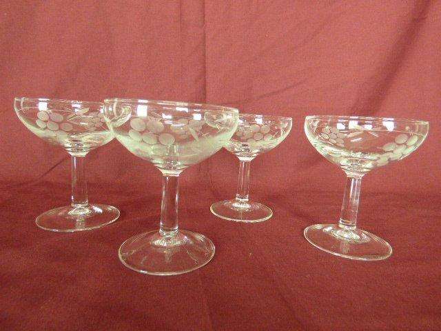 A SET OF 4 VERY PRETTY CHAMPAGNE GLASSES WITH A BEAUTIFUL GRAPE PATTERN. LOVELY!