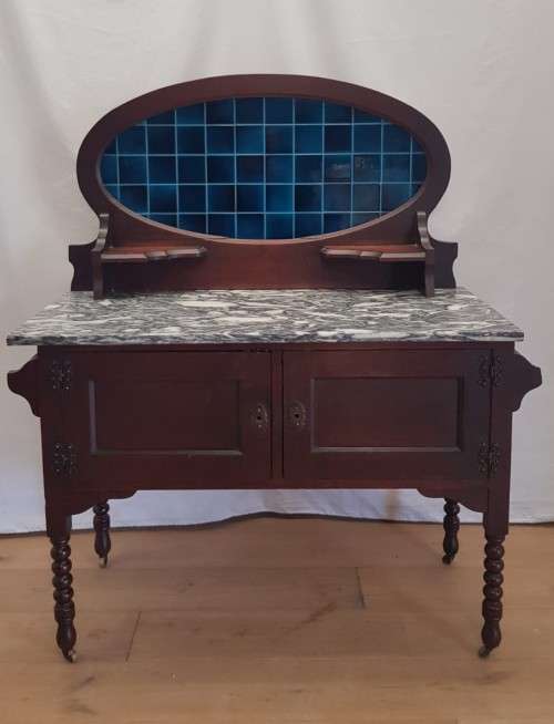 A stunning antique solid oak wash stand with cobalt-blue tiles, grey granite top and bobbin legs
