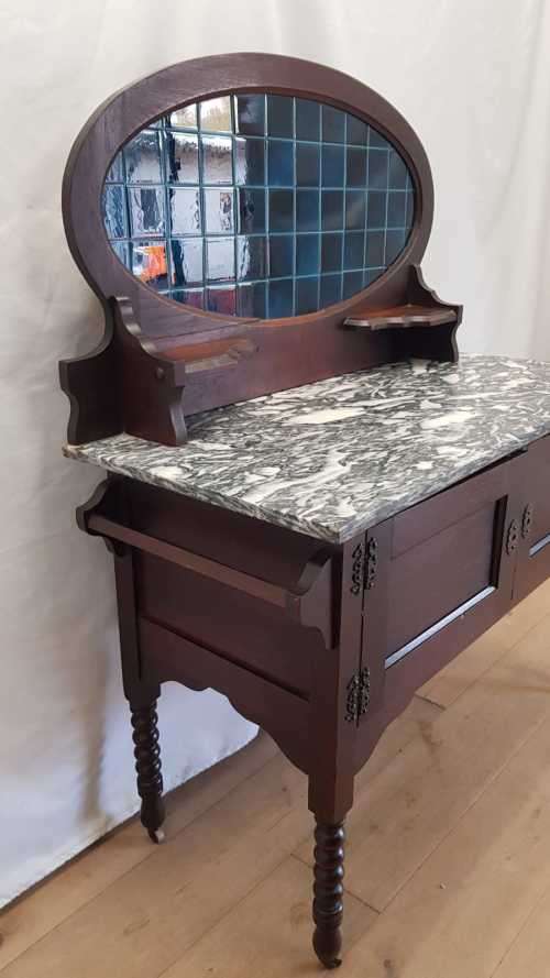 A stunning antique solid oak wash stand with cobalt-blue tiles, grey granite top and bobbin legs