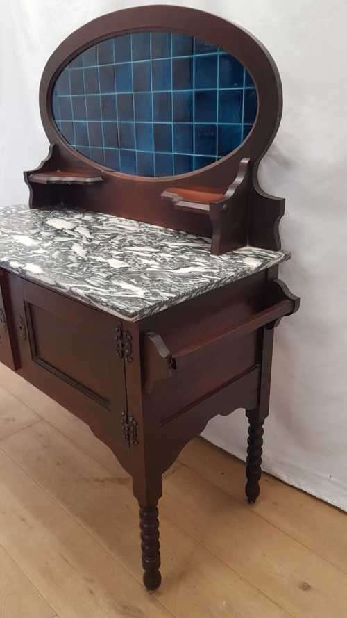 A stunning antique solid oak wash stand with cobalt-blue tiles, grey granite top and bobbin legs