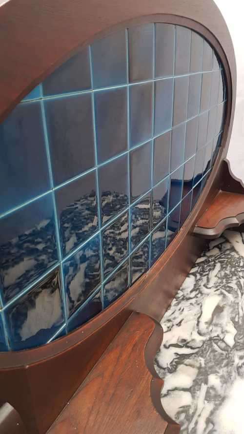 A stunning antique solid oak wash stand with cobalt-blue tiles, grey granite top and bobbin legs