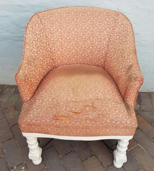 A stylish wrought iron and wood base armchair for restoration