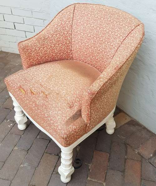 A stylish wrought iron and wood base armchair for restoration