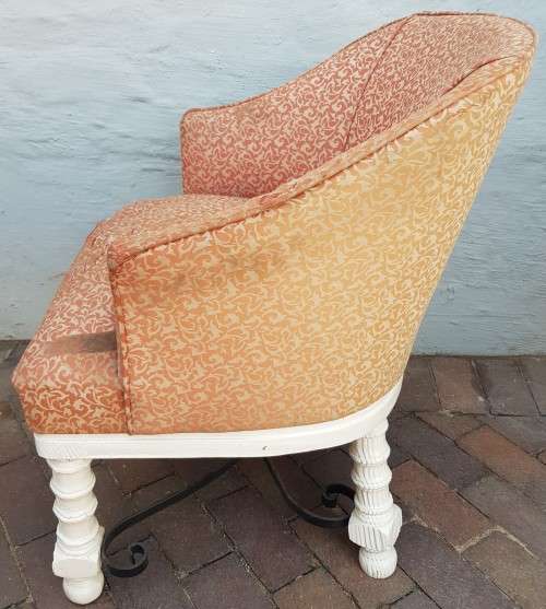 A stylish wrought iron and wood base armchair for restoration