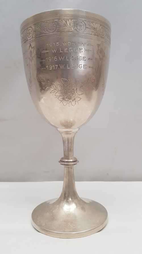A beautiful antique (1910) hallmarked British sterling silver engraved chalice trophy