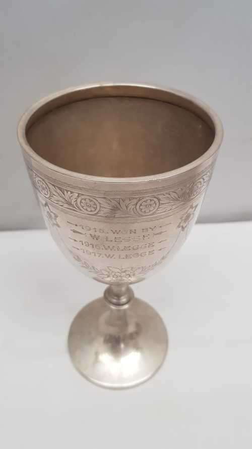A beautiful antique (1910) hallmarked British sterling silver engraved chalice trophy