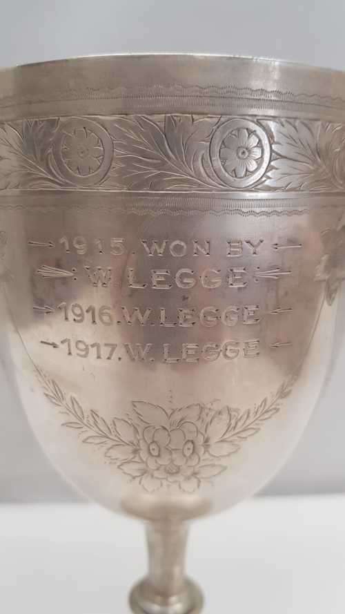 A beautiful antique (1910) hallmarked British sterling silver engraved chalice trophy