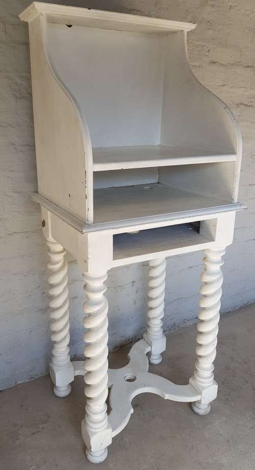 A painted white podium, solid timber