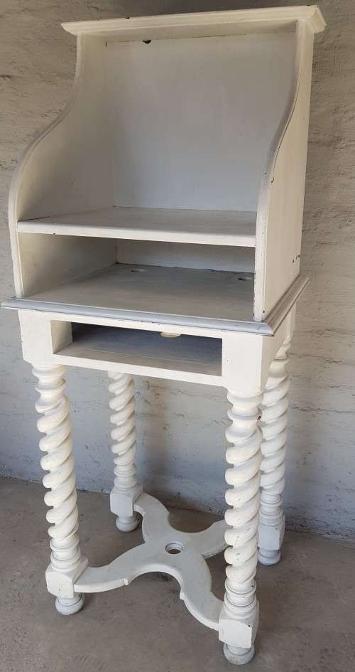 A painted white podium, solid timber