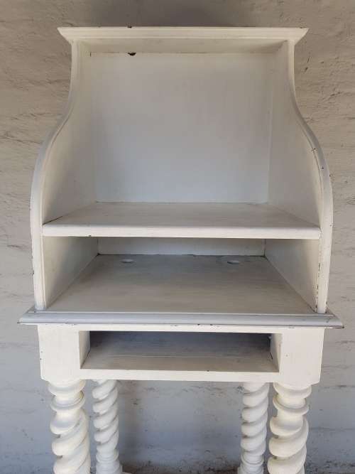 A painted white podium, solid timber
