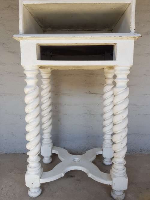 A painted white podium, solid timber